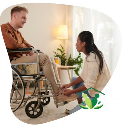 Man with disability in wheelchair with carer